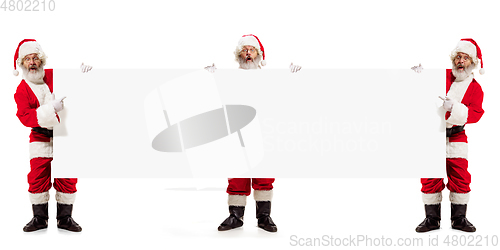 Image of Emotional Santa Claus greeting with New Year and Christmas, copyspace