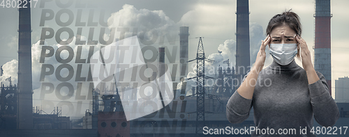 Image of Caucasian woman wearing the respiratory protection mask against air pollution and dusk with factories on background