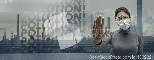 Image of Caucasian woman wearing the respiratory protection mask against air pollution and dusk with factories on background