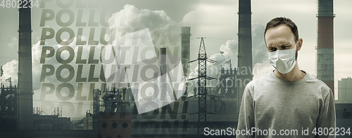 Image of Caucasian man wearing the respiratory protection mask against air pollution and dusk with factories on background