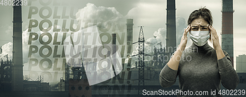 Image of Caucasian woman wearing the respiratory protection mask against air pollution and dusk with factories on background