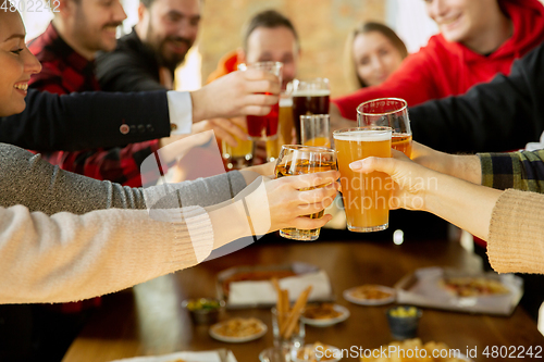 Image of Happy co-workers celebrating while company party and corporate event