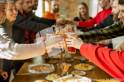 Image of Happy co-workers celebrating while company party and corporate event