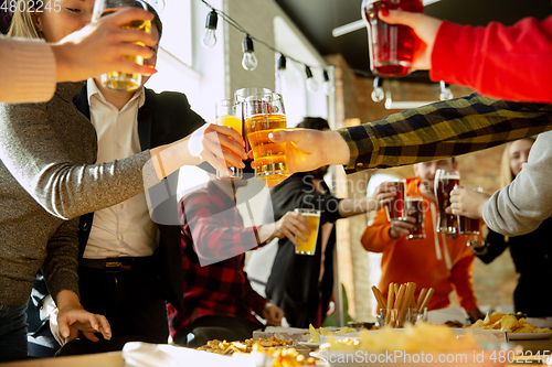 Image of Happy co-workers celebrating while company party and corporate event