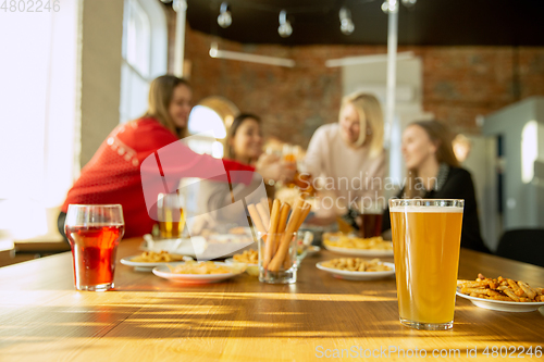 Image of Happy co-workers celebrating while company party and corporate event