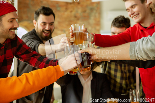 Image of Happy co-workers celebrating while company party and corporate event