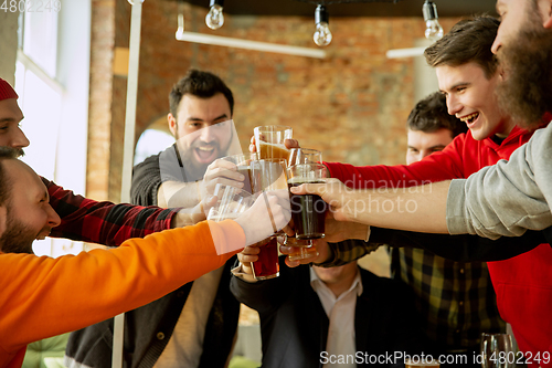 Image of Happy co-workers celebrating while company party and corporate event