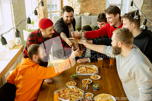 Image of Happy co-workers celebrating while company party and corporate event