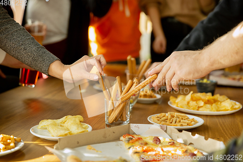 Image of Happy co-workers celebrating while company party and corporate event