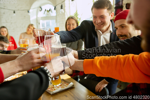 Image of Happy co-workers celebrating while company party and corporate event