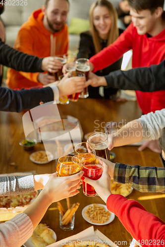 Image of Happy co-workers celebrating while company party and corporate event