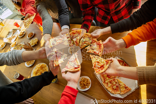 Image of Happy co-workers celebrating while company party and corporate event