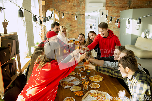 Image of Happy co-workers celebrating while company party and corporate event