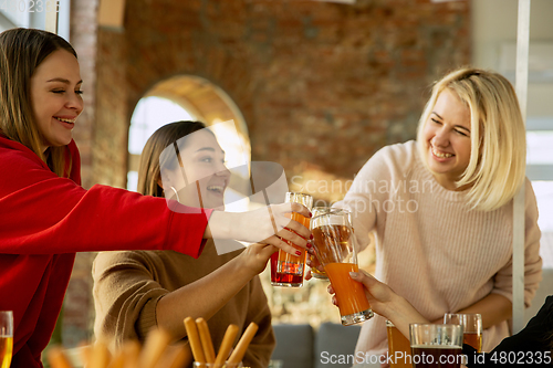 Image of Happy co-workers celebrating while company party and corporate event