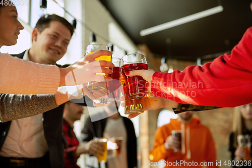 Image of Happy co-workers celebrating while company party and corporate event