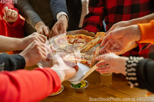 Image of Happy co-workers celebrating while company party and corporate event