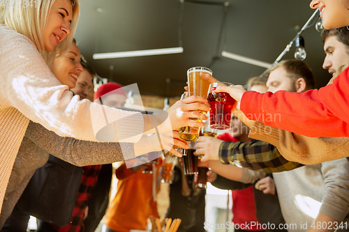 Image of Happy co-workers celebrating while company party and corporate event