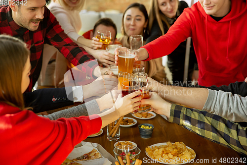 Image of Happy co-workers celebrating while company party and corporate event