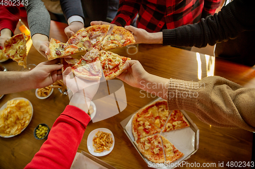 Image of Happy co-workers celebrating while company party and corporate event