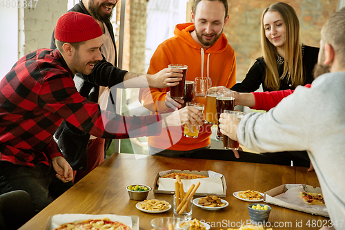 Image of Happy co-workers celebrating while company party and corporate event