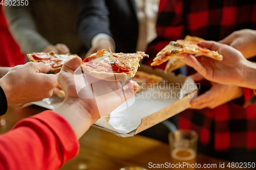 Image of Happy co-workers celebrating while company party and corporate event