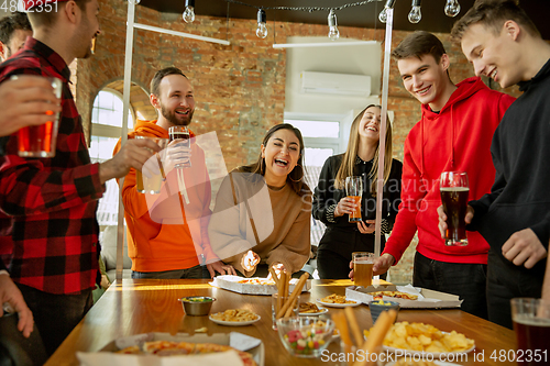 Image of Happy co-workers celebrating while company party and corporate event