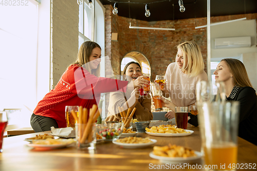 Image of Happy co-workers celebrating while company party and corporate event