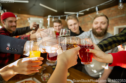 Image of Happy co-workers celebrating while company party and corporate event