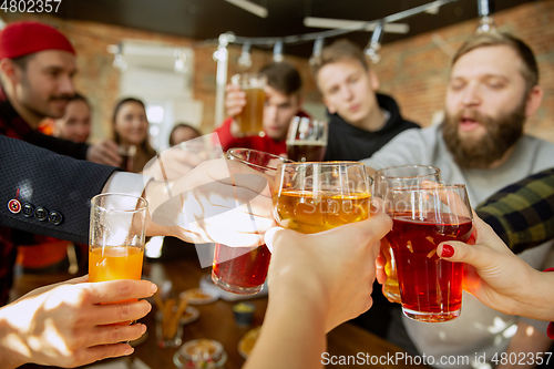 Image of Happy co-workers celebrating while company party and corporate event