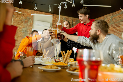 Image of Happy co-workers celebrating while company party and corporate event