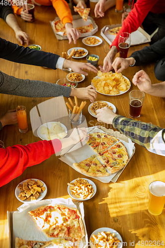 Image of Happy co-workers celebrating while company party and corporate event