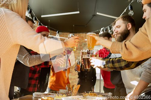 Image of Happy co-workers celebrating while company party and corporate event