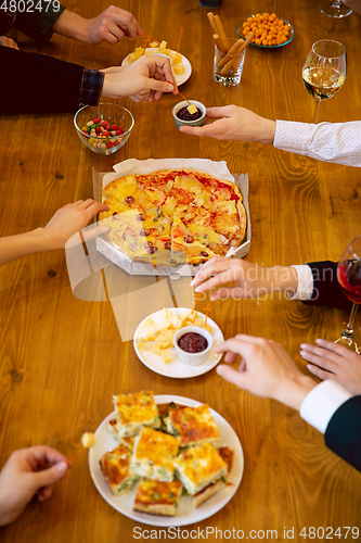 Image of Happy co-workers celebrating while company party and corporate event