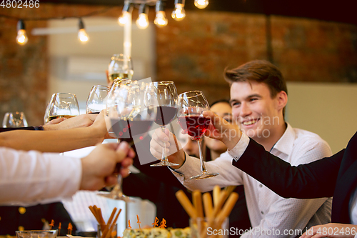 Image of Happy co-workers celebrating while company party and corporate event