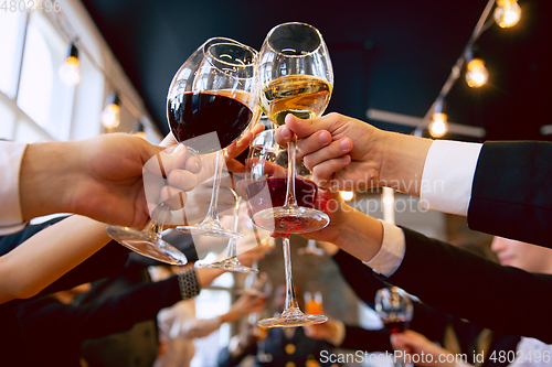 Image of Happy co-workers celebrating while company party and corporate event