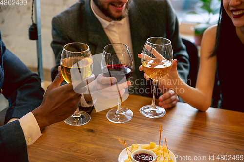 Image of Happy co-workers celebrating while company party and corporate event