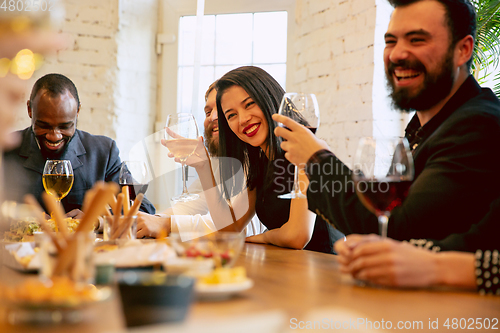 Image of Happy co-workers celebrating while company party and corporate event