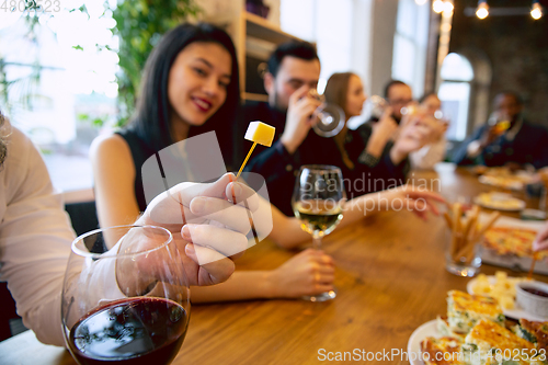 Image of Happy co-workers celebrating while company party and corporate event