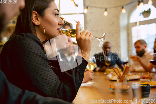 Image of Happy co-workers celebrating while company party and corporate event