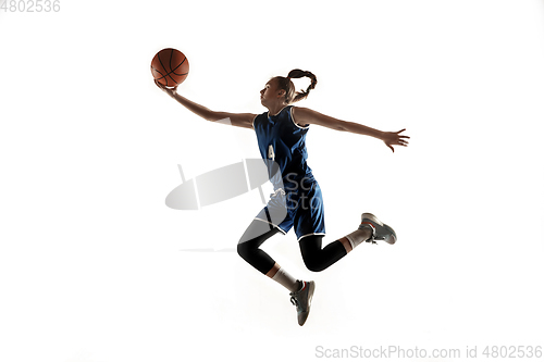 Image of Young caucasian female basketball player against white studio background