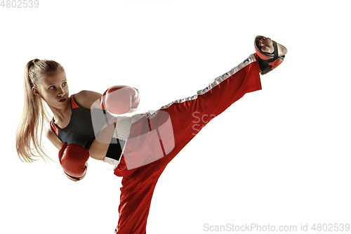 Image of Young female kickboxing fighter training isolated on white background