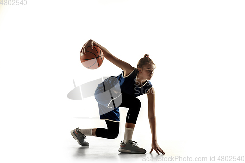 Image of Young caucasian female basketball player against white studio background