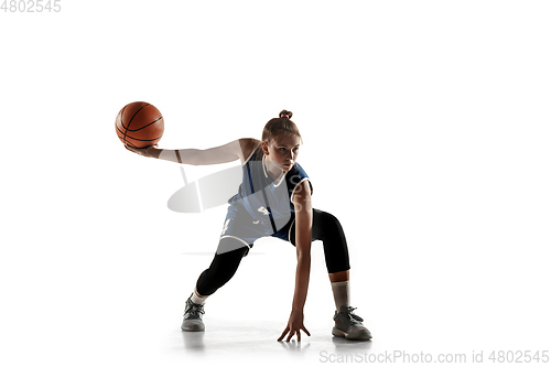 Image of Young caucasian female basketball player against white studio background