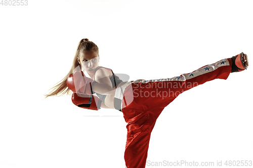 Image of Young female kickboxing fighter training isolated on white background