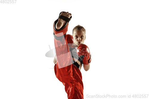 Image of Young female kickboxing fighter training isolated on white background