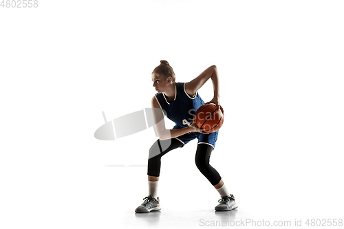 Image of Young caucasian female basketball player against white studio background