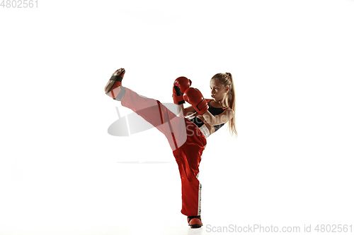 Image of Young female kickboxing fighter training isolated on white background