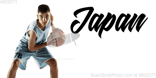 Image of Full length portrait of a young basketball player with ball