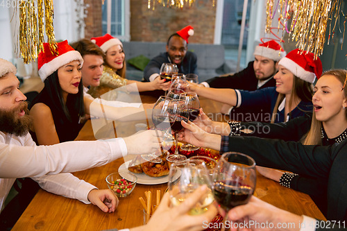 Image of Happy co-workers celebrating while company party for New Year and Christmas