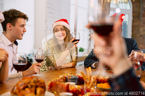 Image of Happy co-workers celebrating while company party for New Year and Christmas